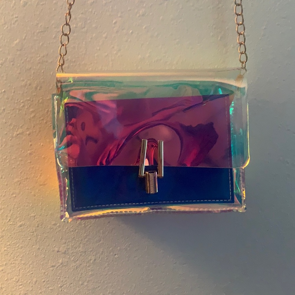 Clear multi-chrome purse. Gently used w/ some scuff marks, in good condition